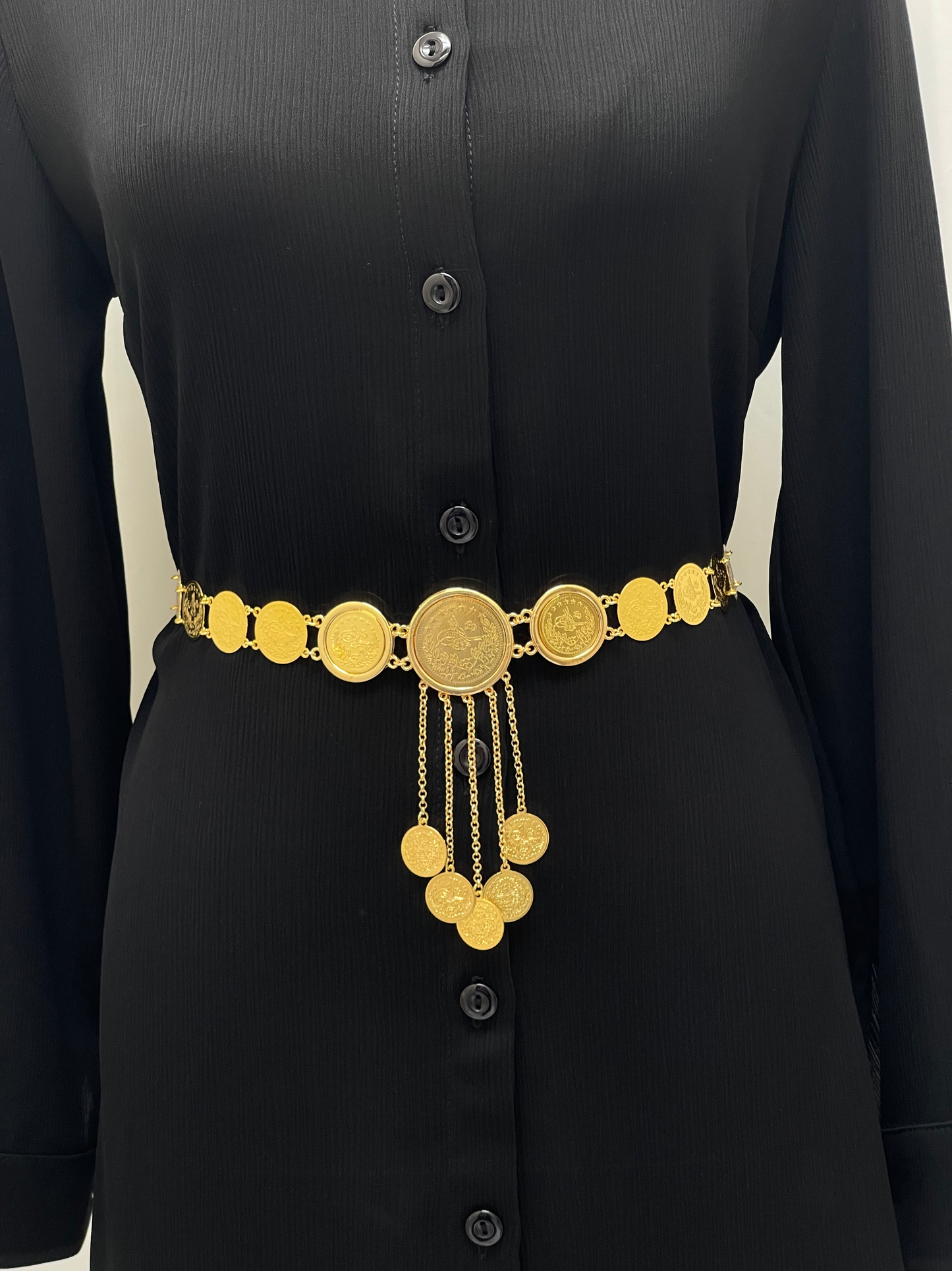 Lerat Belt with Mkhamas Imitated Gold by Palestinian Elegance worn over black buttoned dress