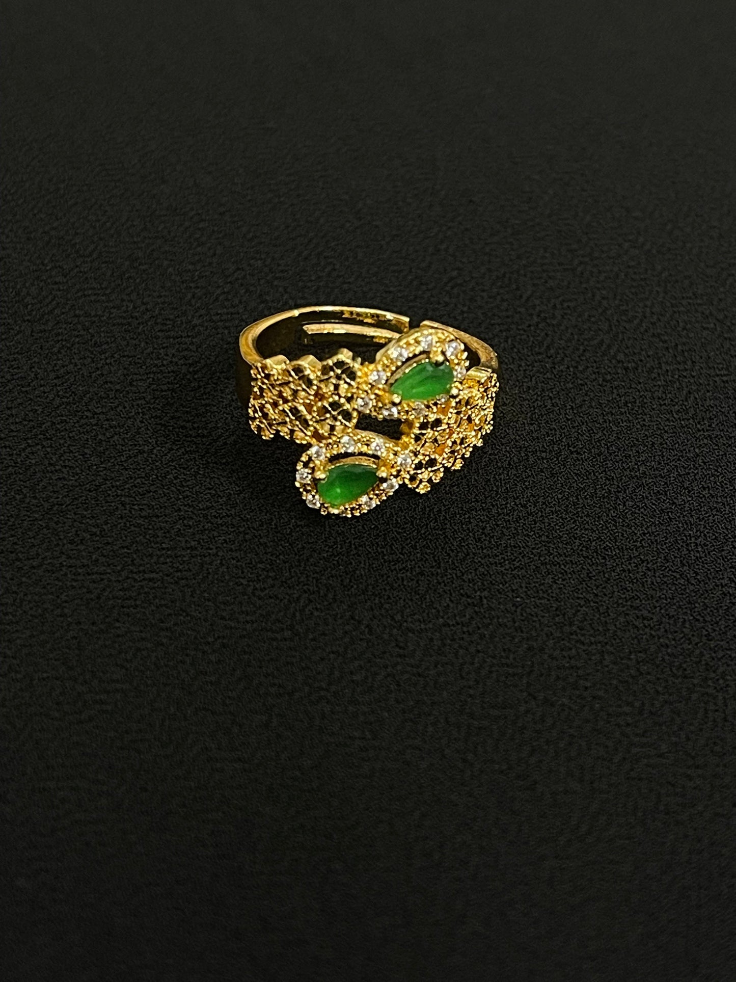 Elegant Palestinian gold jewelry set ring with green stones and intricate gold detailing