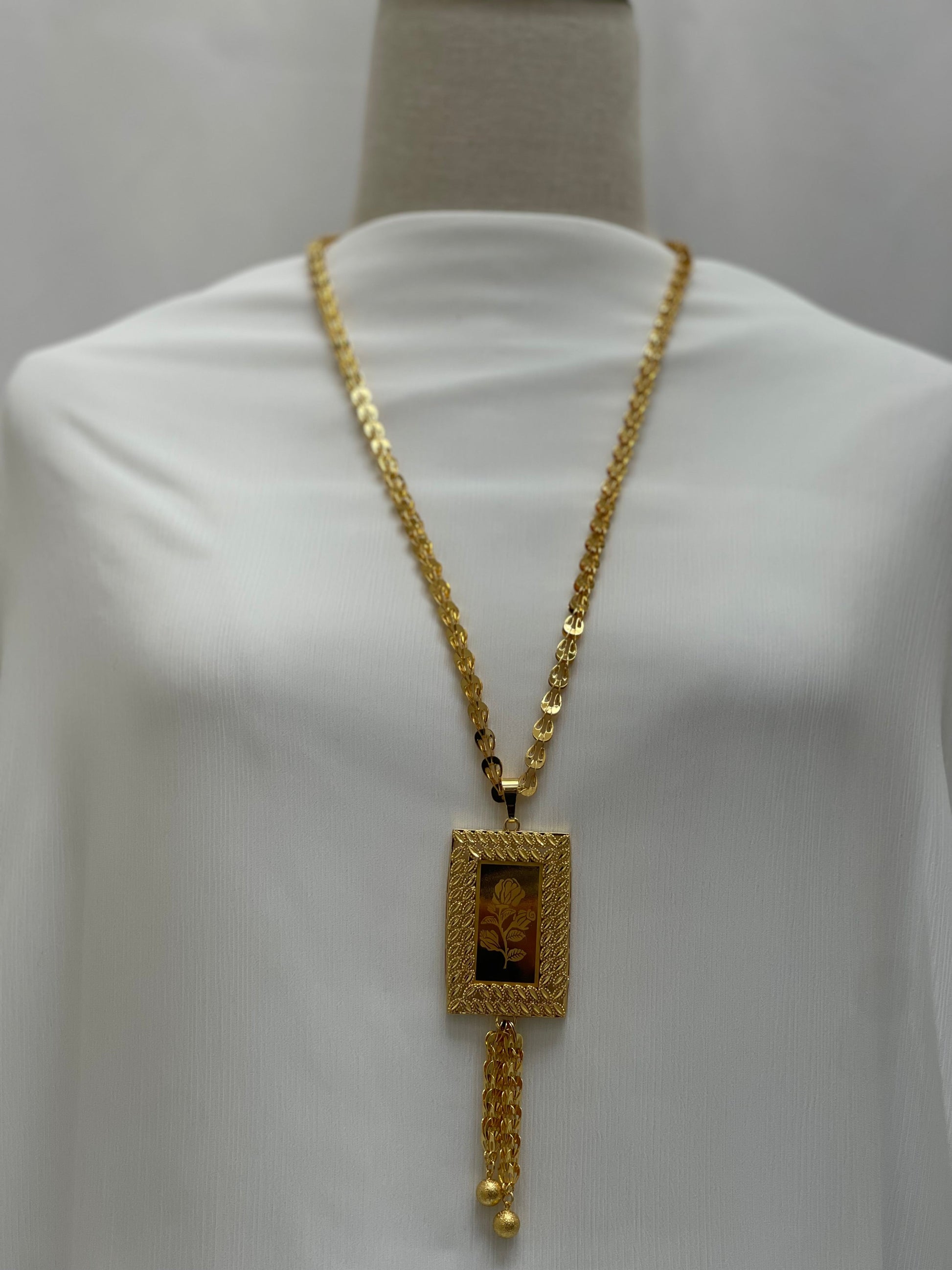 Palestinian Elegance long rose pendant necklace with gold chain and rectangular floral pendant