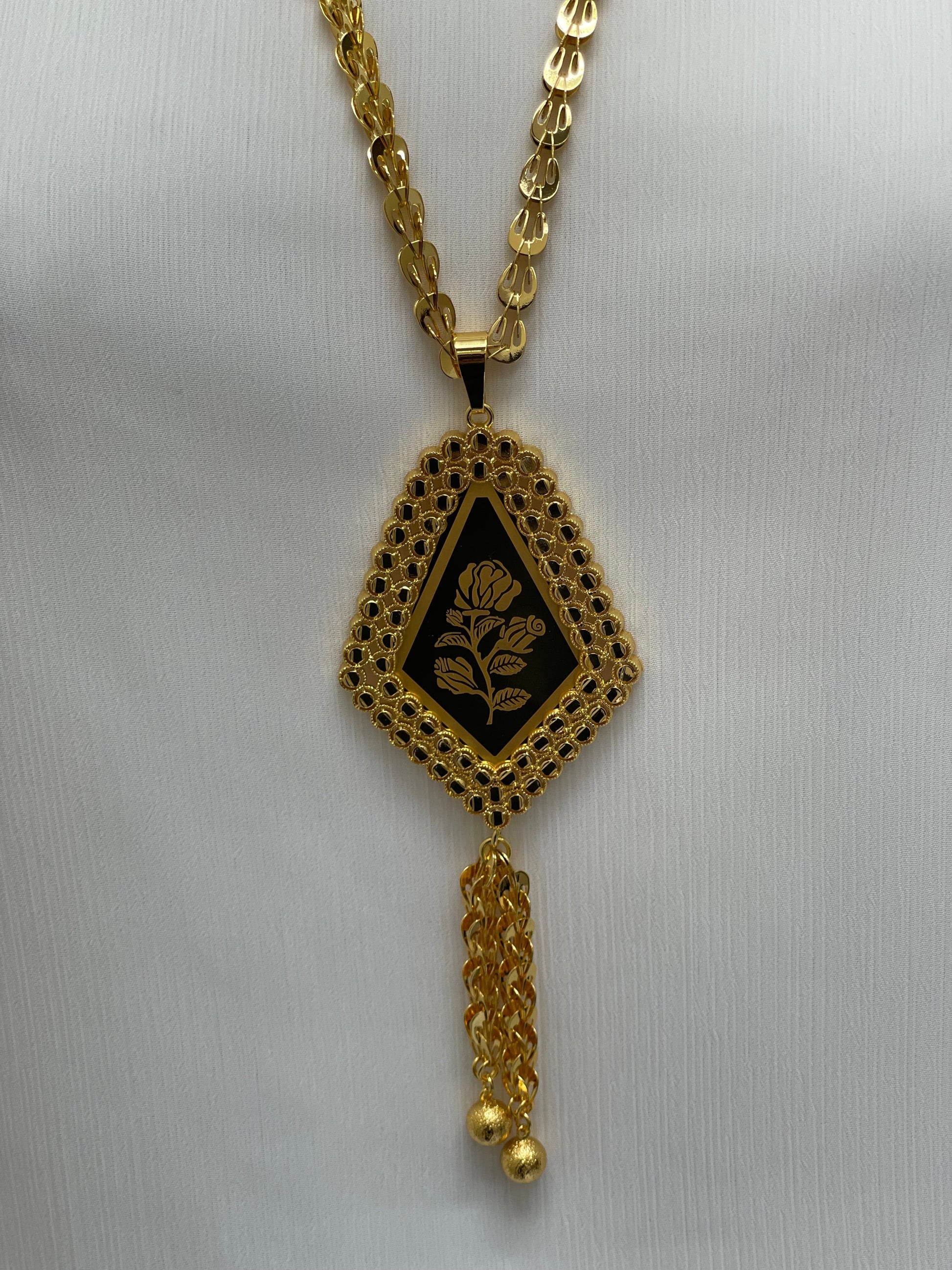 Palestinian Elegance long rose pendant necklace with intricate gold chain and floral design pendant