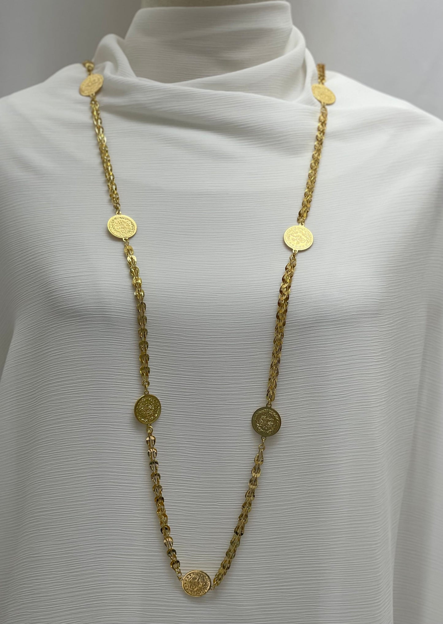 Palestinian coin necklace by Palestinian Elegance featuring gold-tone coins on a long chain accessory