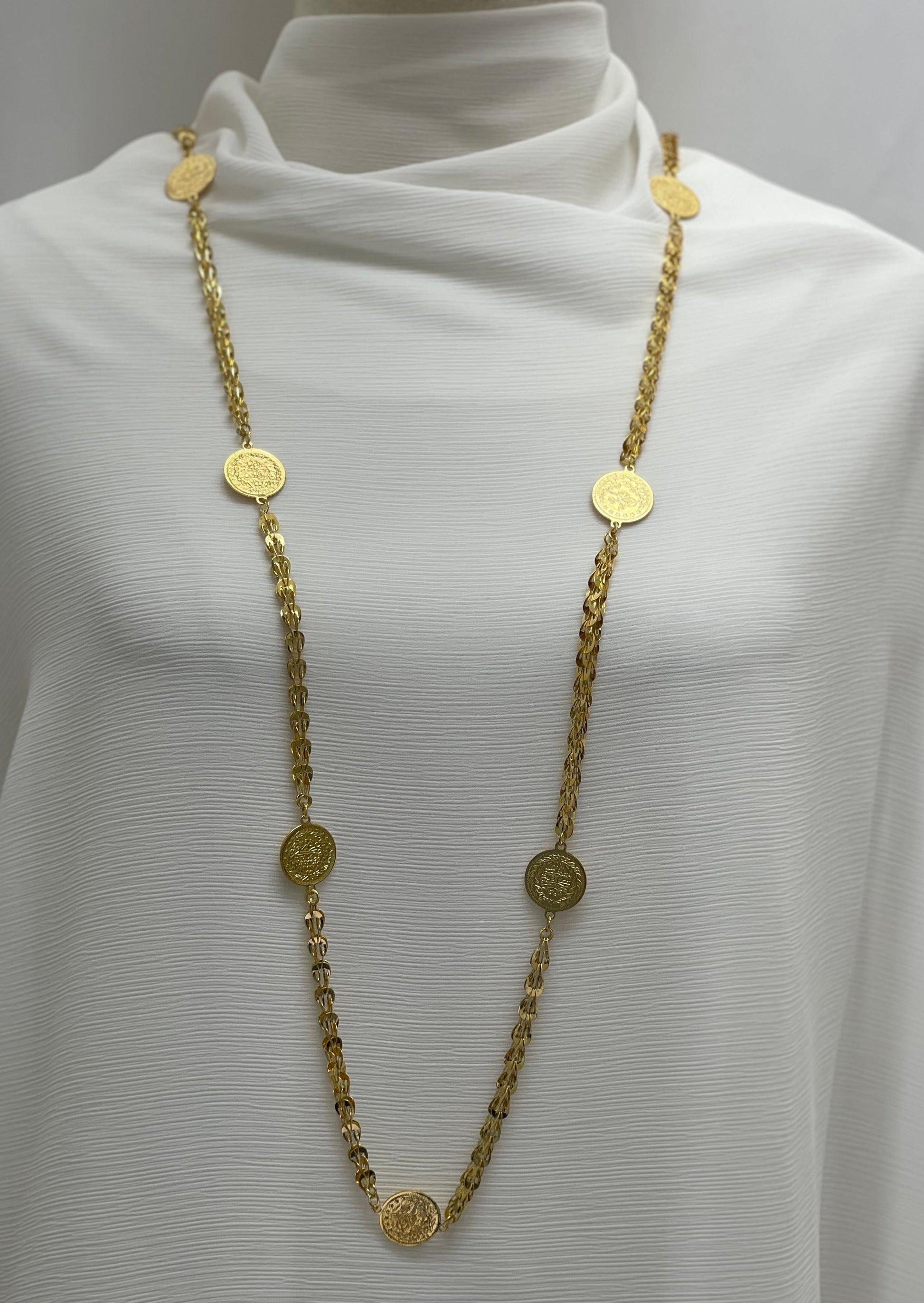 Palestinian coin necklace by Palestinian Elegance featuring gold-tone coins on a long chain accessory