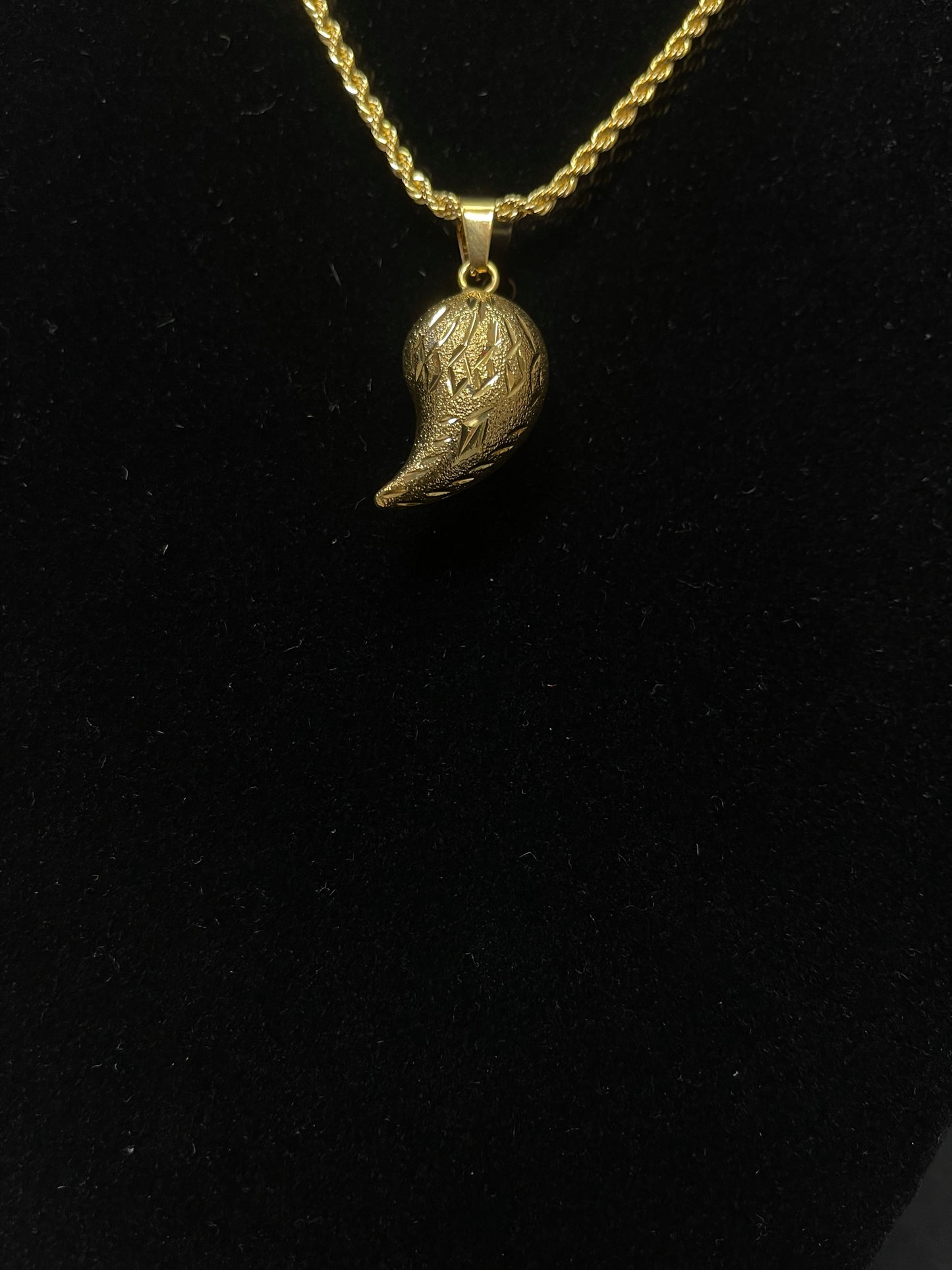 Palestinian Elegance imitated gold almond shape gold pendant on a twisted chain necklace