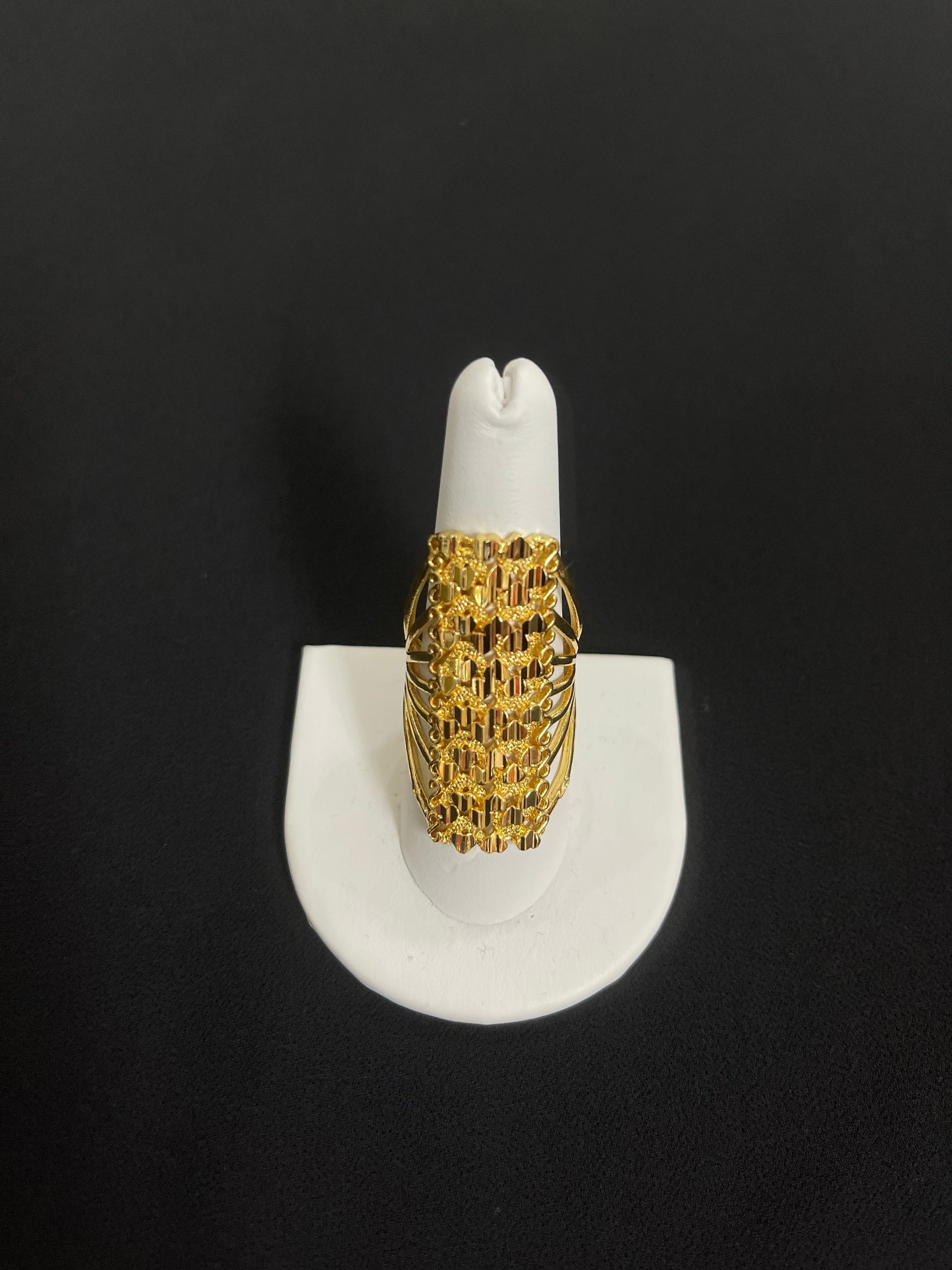 Elegant gold layered ring in imitated gold by Palestinian Elegance displayed on white ring holder