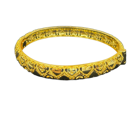 Imitated gold heart design gold bangle bracelet by Palestinian Elegance with intricate heart patterns