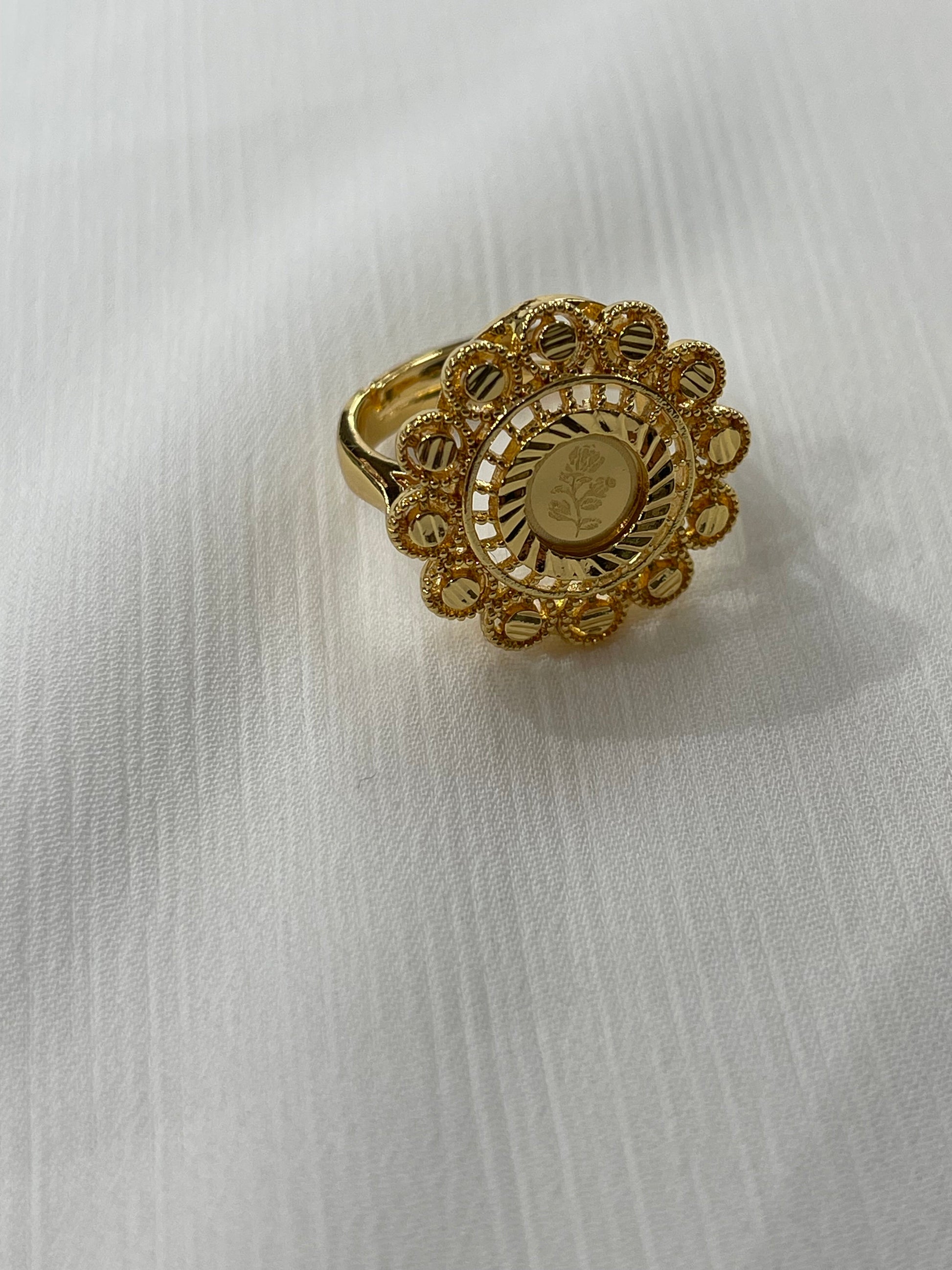 Gold ring with intricate floral design from Palestinian Elegance gold jewelry set for women