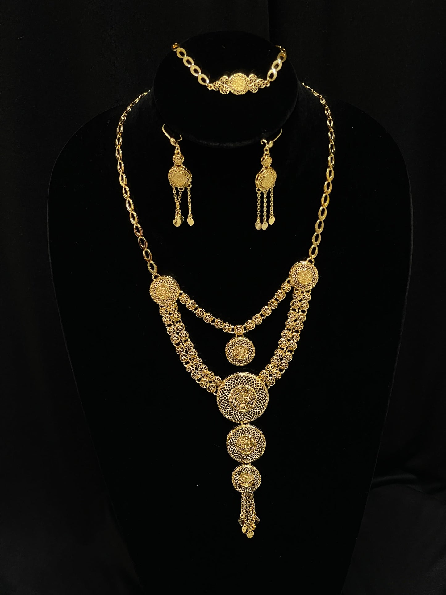 Palestinian Elegance gold layered necklace set with intricate circular pendant design and matching earrings