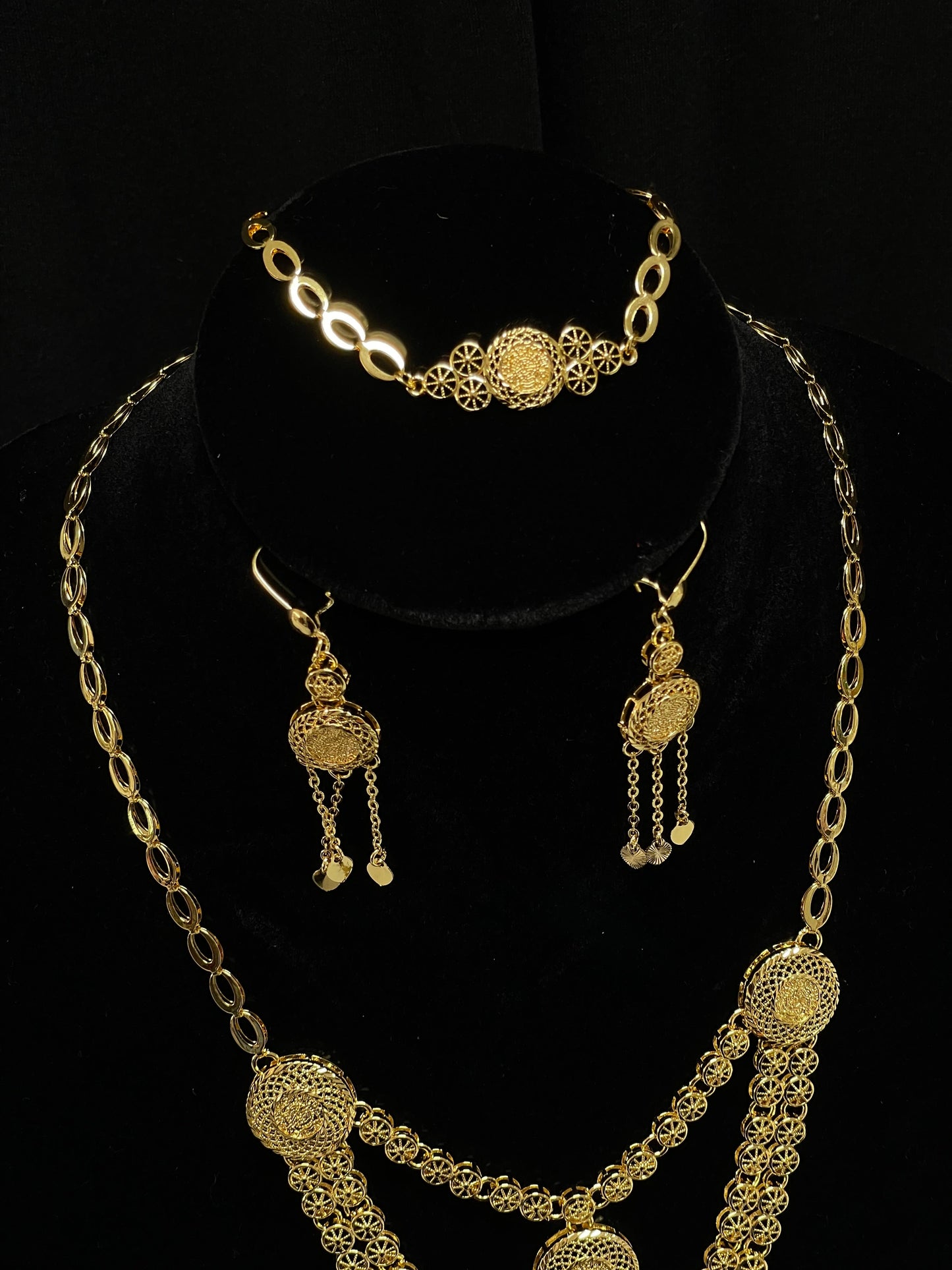 Palestinian Elegance gold layered necklace set with intricate filigree pendant and matching earrings
