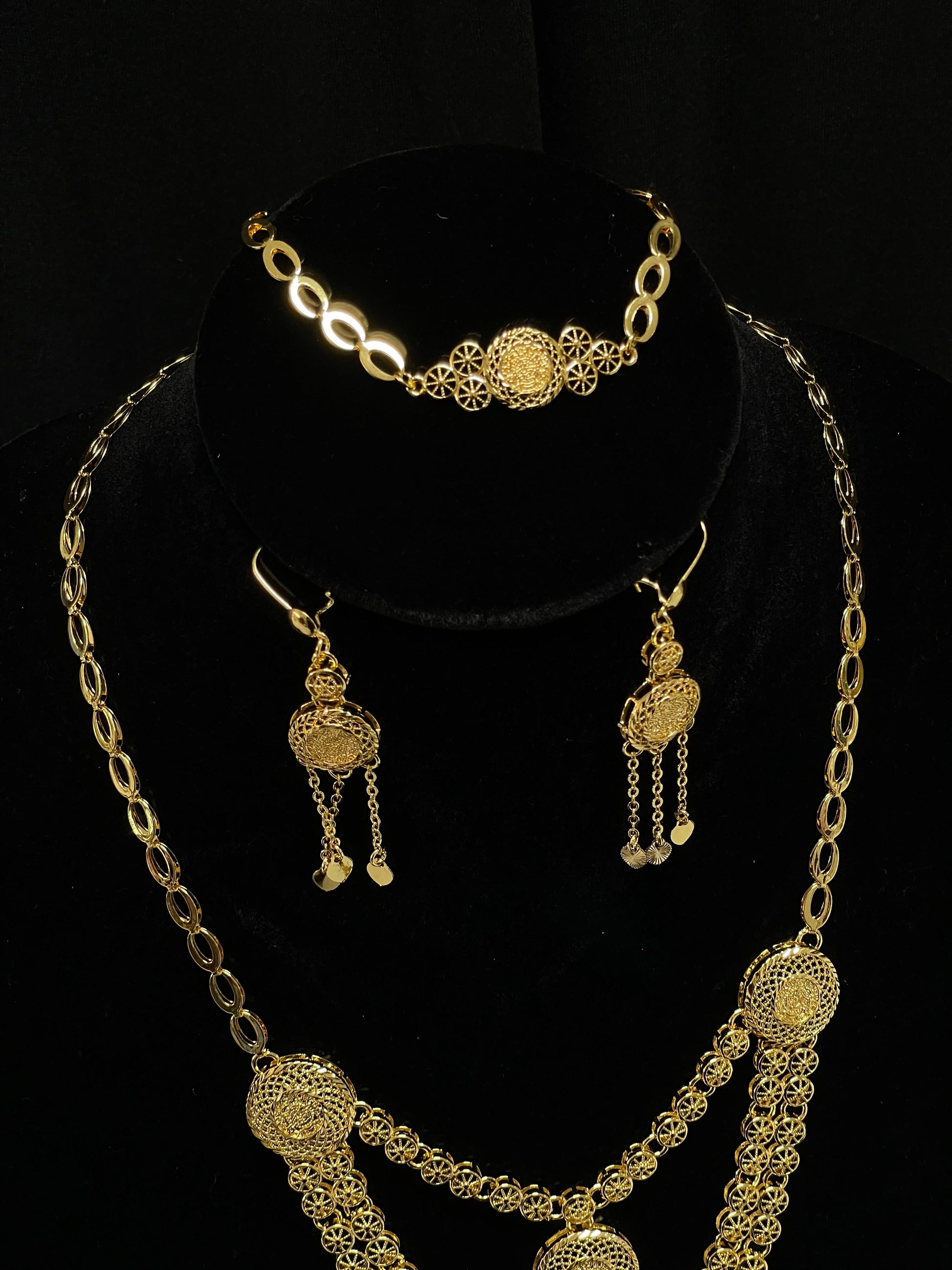 Palestinian Elegance gold layered necklace set with intricate filigree pendant and matching earrings
