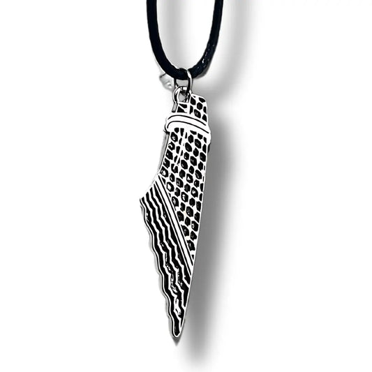 Palestinian Elegance handcrafted kuffiyeh necklace with black cord and detailed silver pendant