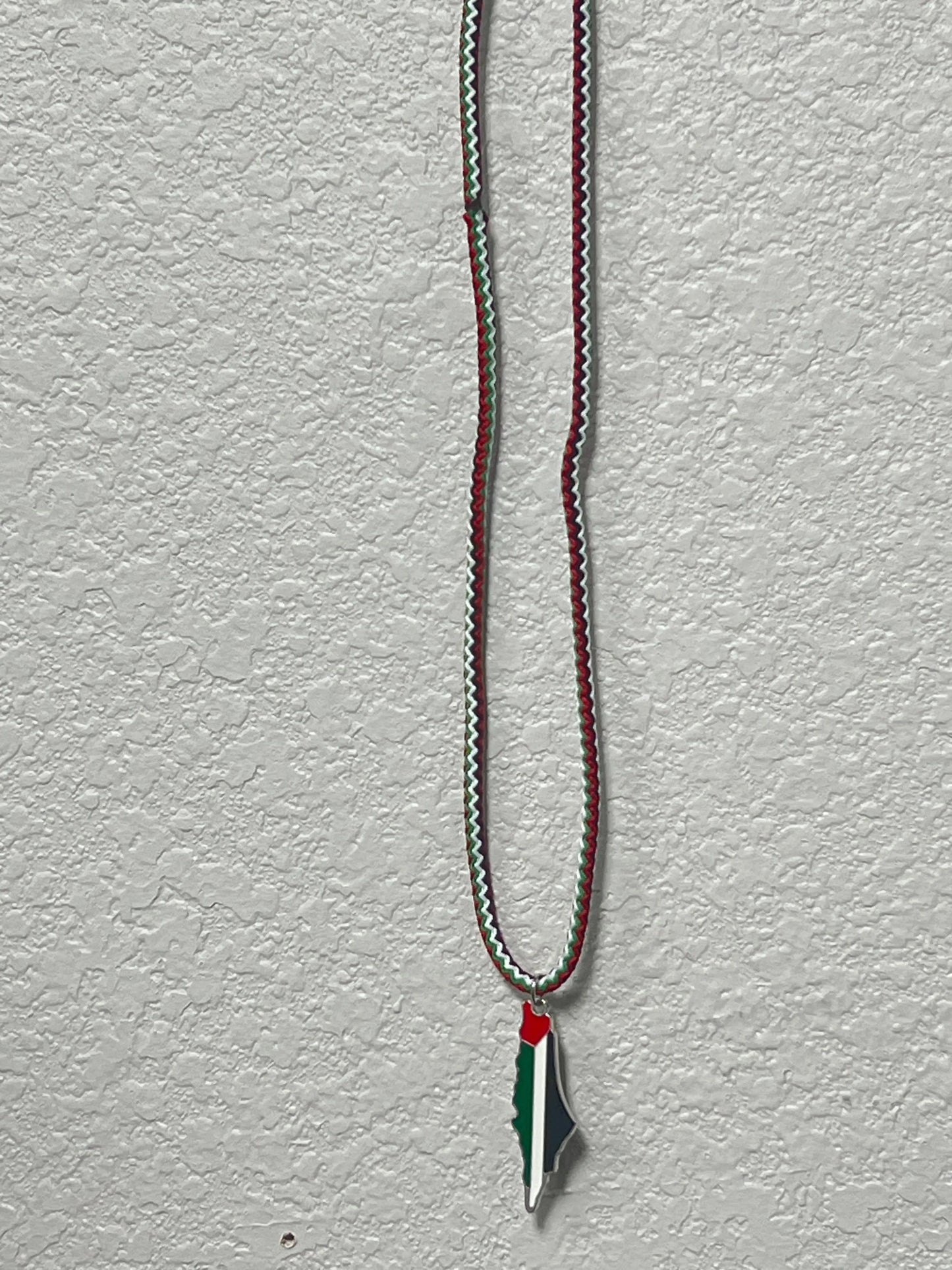 Handmade Palestinian silver necklace with a pendant in the shape of Palestine in national colors