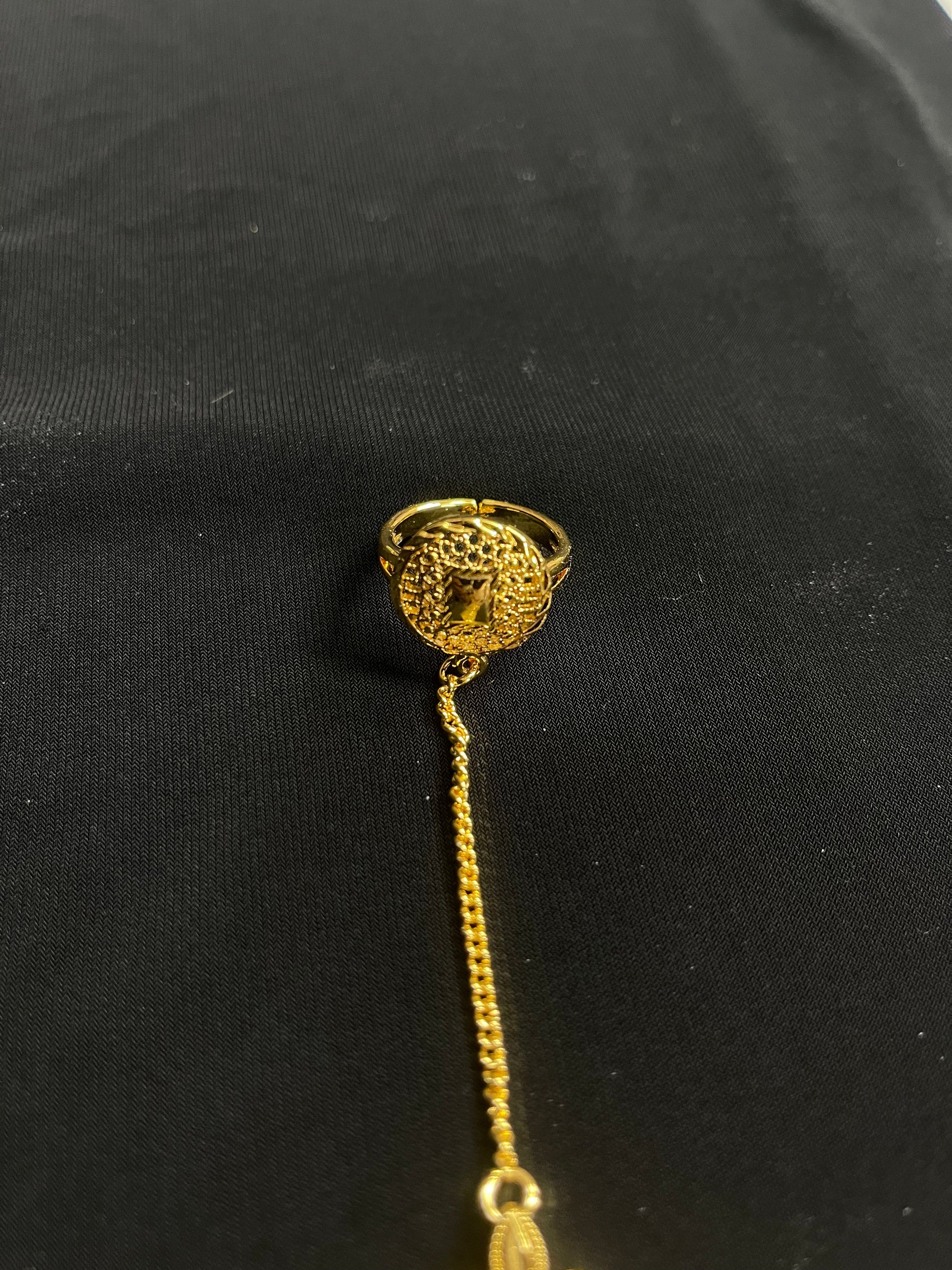 Imitated Gold Bracelet with Ring Design featuring intricate chain and detailed ring from Palestinian Elegance