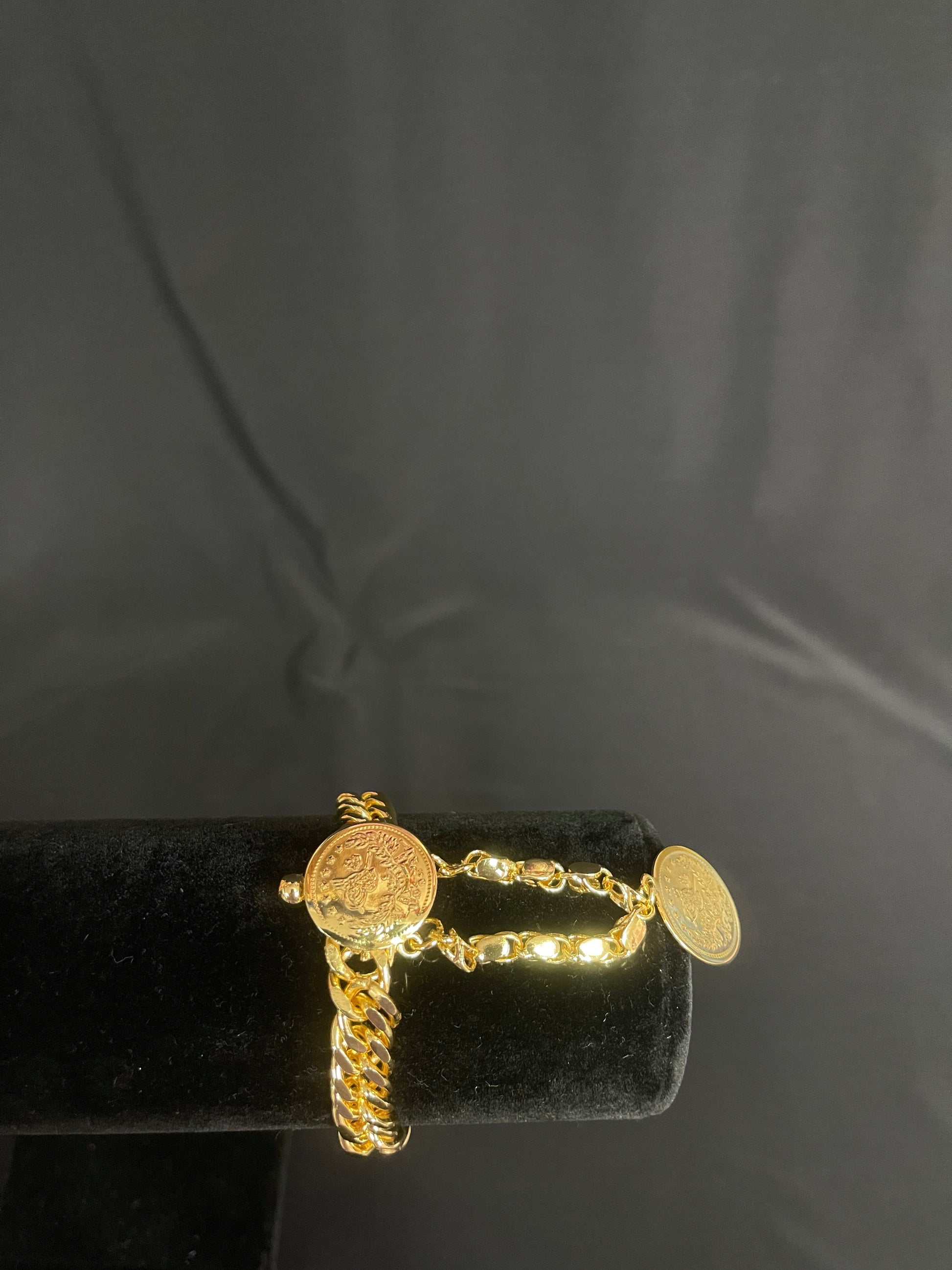 Imitated Gold Chain Bracelet with Extended by Palestinian Elegance displayed on black velvet stand