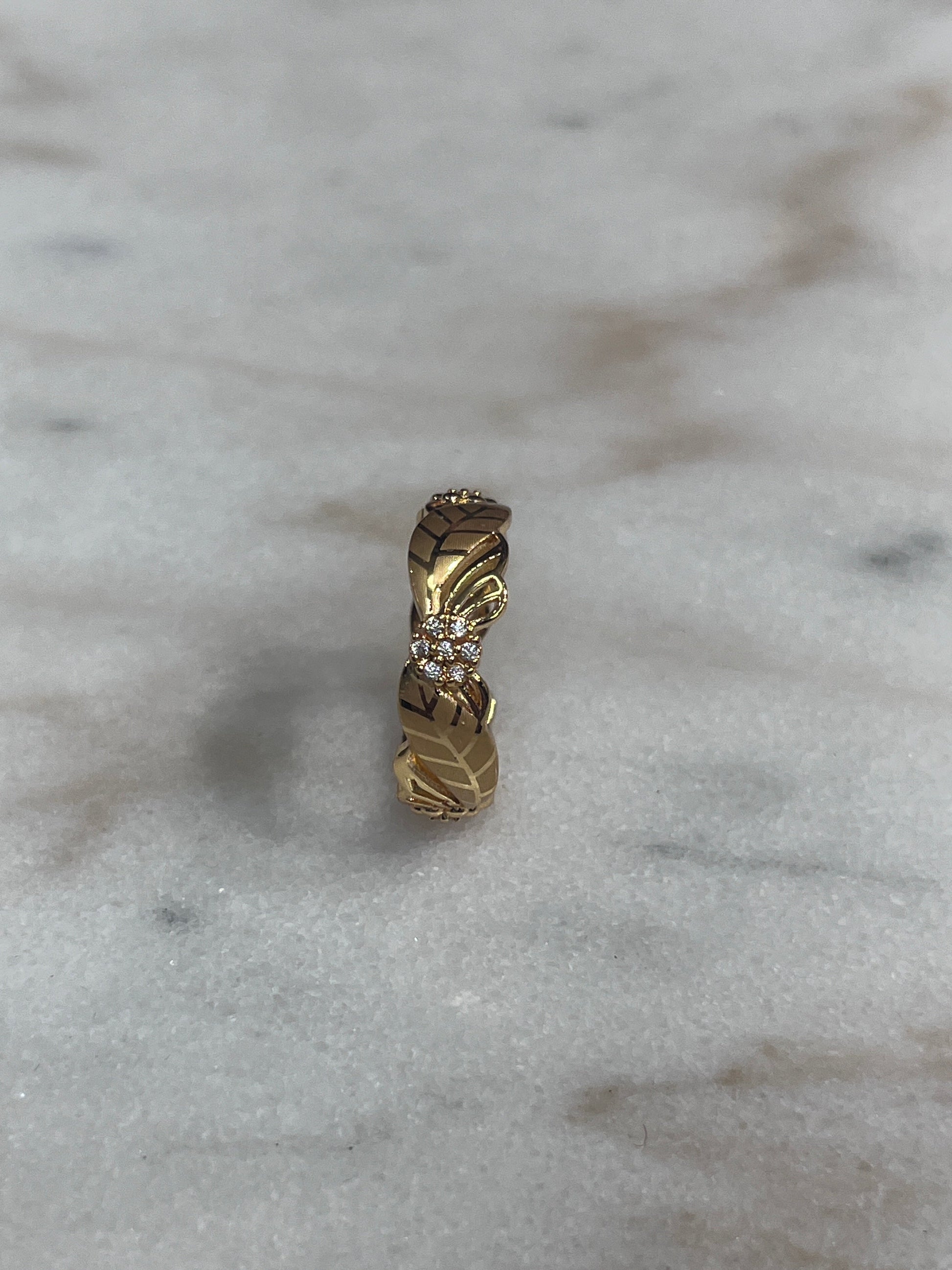 Palestinian Elegance Imitated Gold Ring with Flower Design featuring intricate floral patterns and sparkling stones