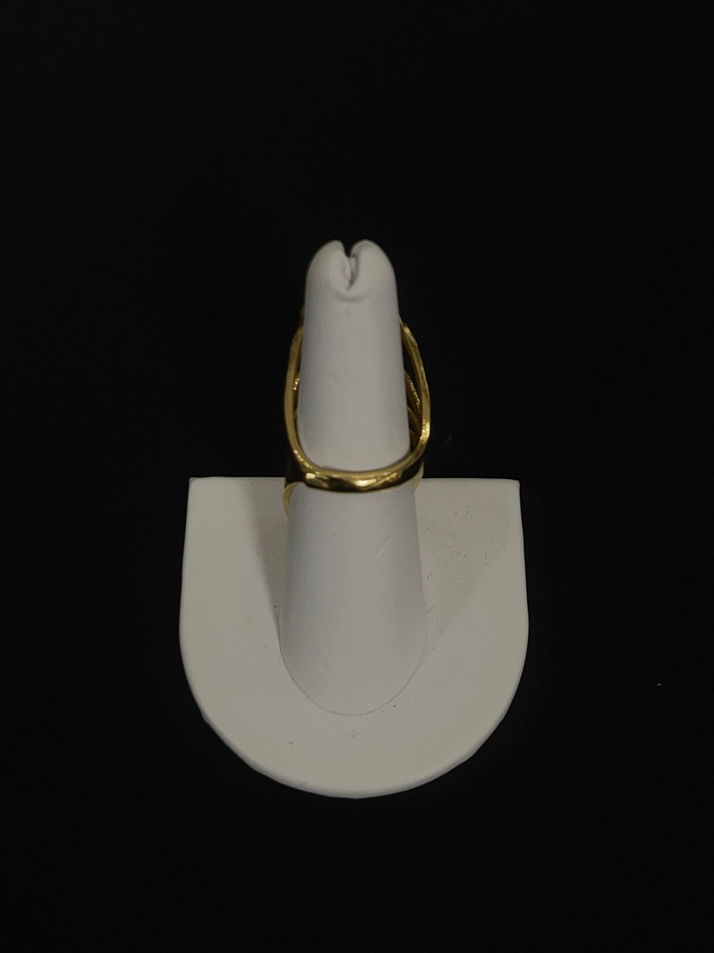 Layered hearts gold ring made of imitated gold displayed on white stand by Palestinian Elegance