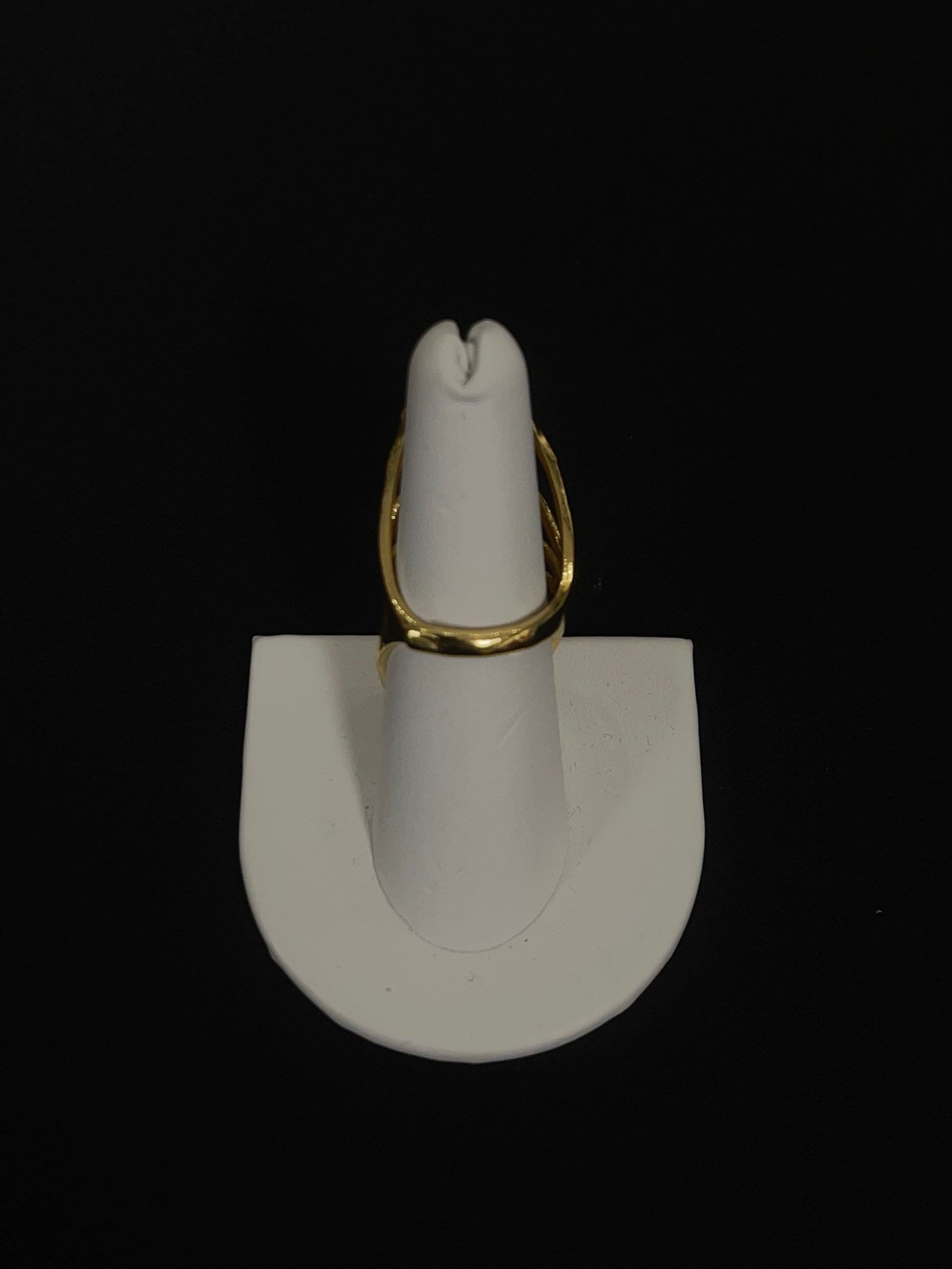Layered hearts gold ring made of imitated gold displayed on white stand by Palestinian Elegance