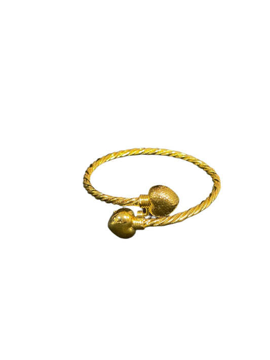 Mabroma Gold Heart Bracelet by Palestinian Elegance with twisted band and two heart-shaped ends