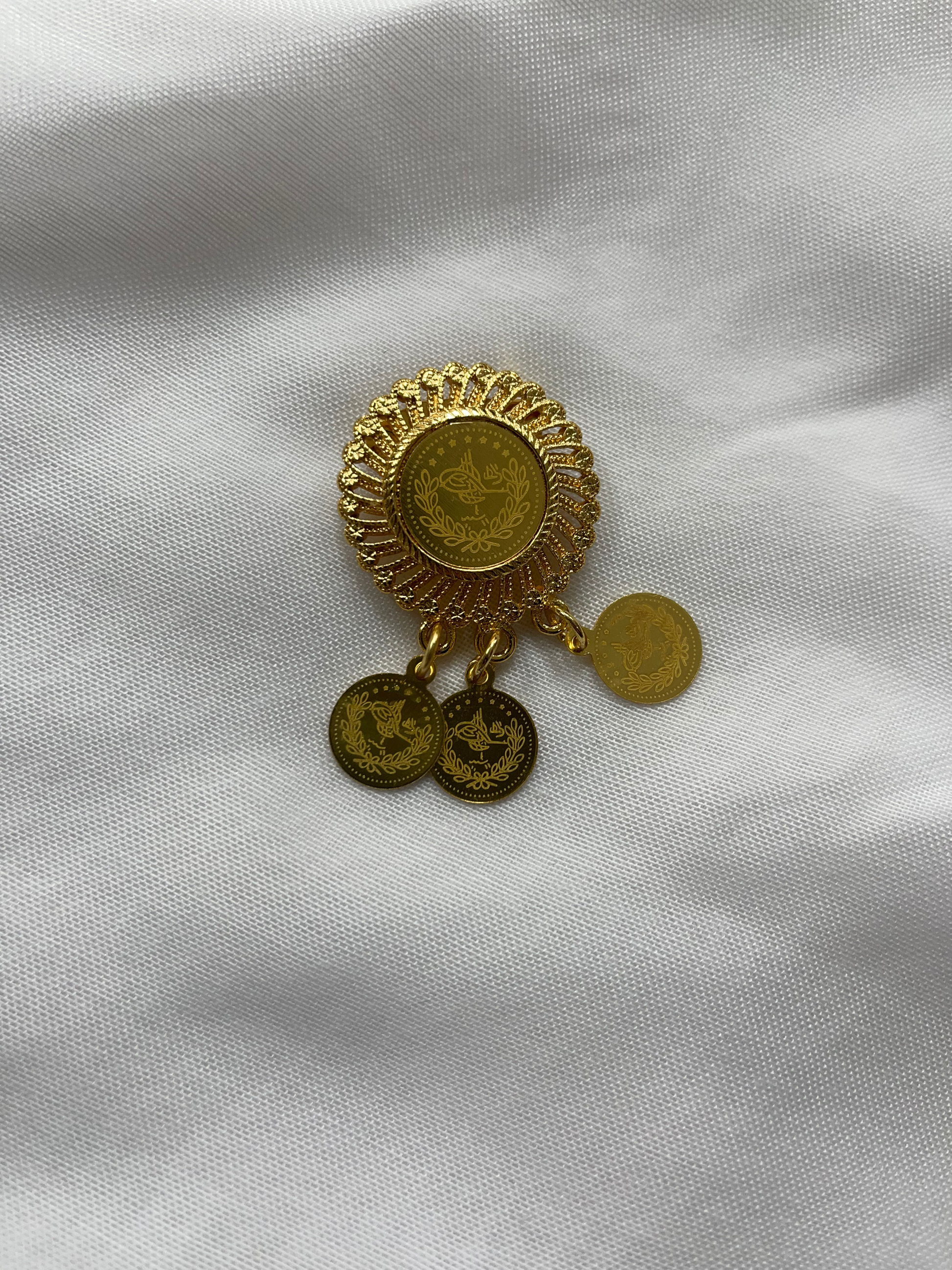 Palestinian Elegance imitated gold half lera necklace set with coin pendant design on white fabric