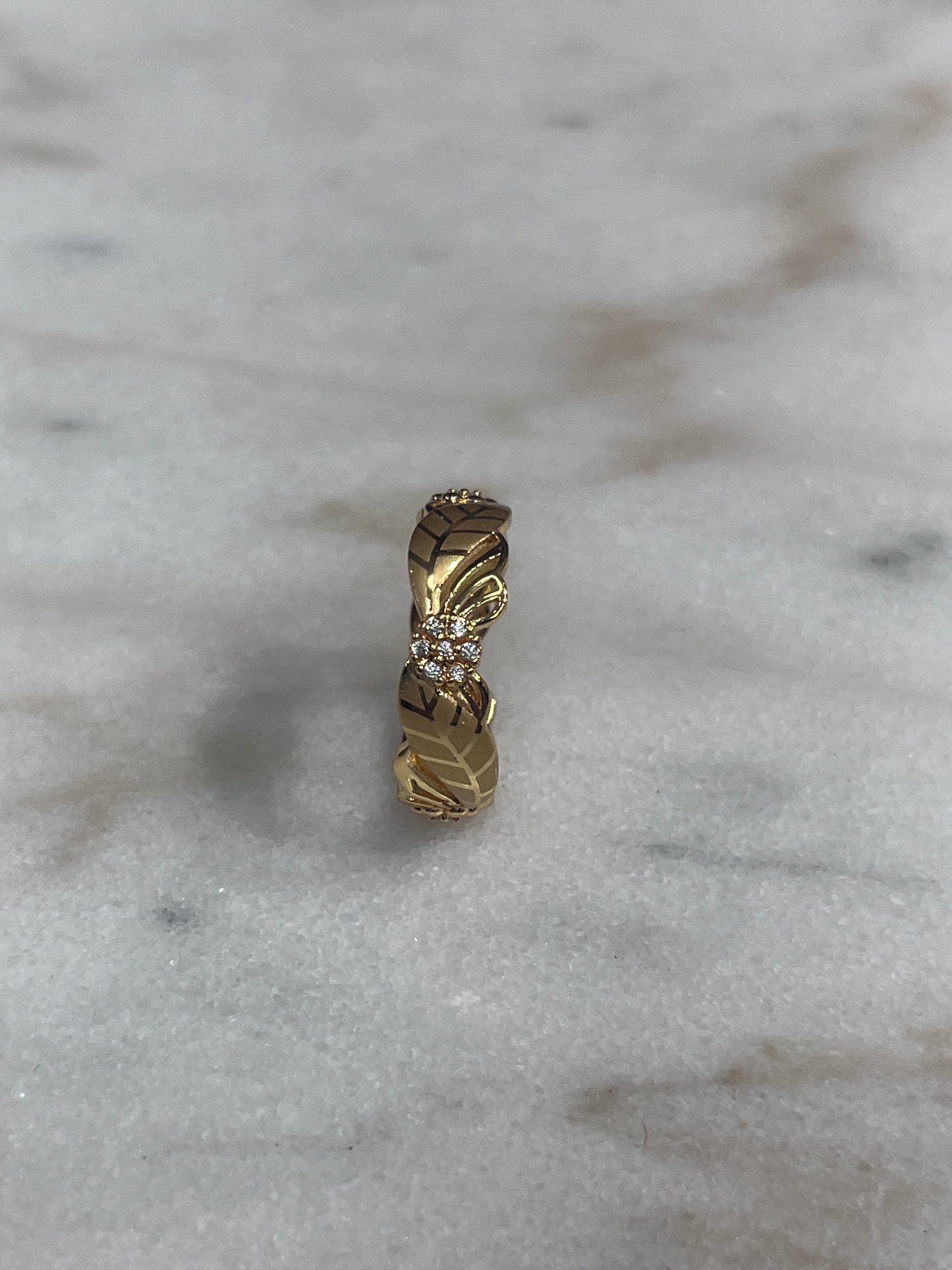 Imitated gold ring with intricate design and small stones from Palestinian Elegance heritage-inspired jewelry