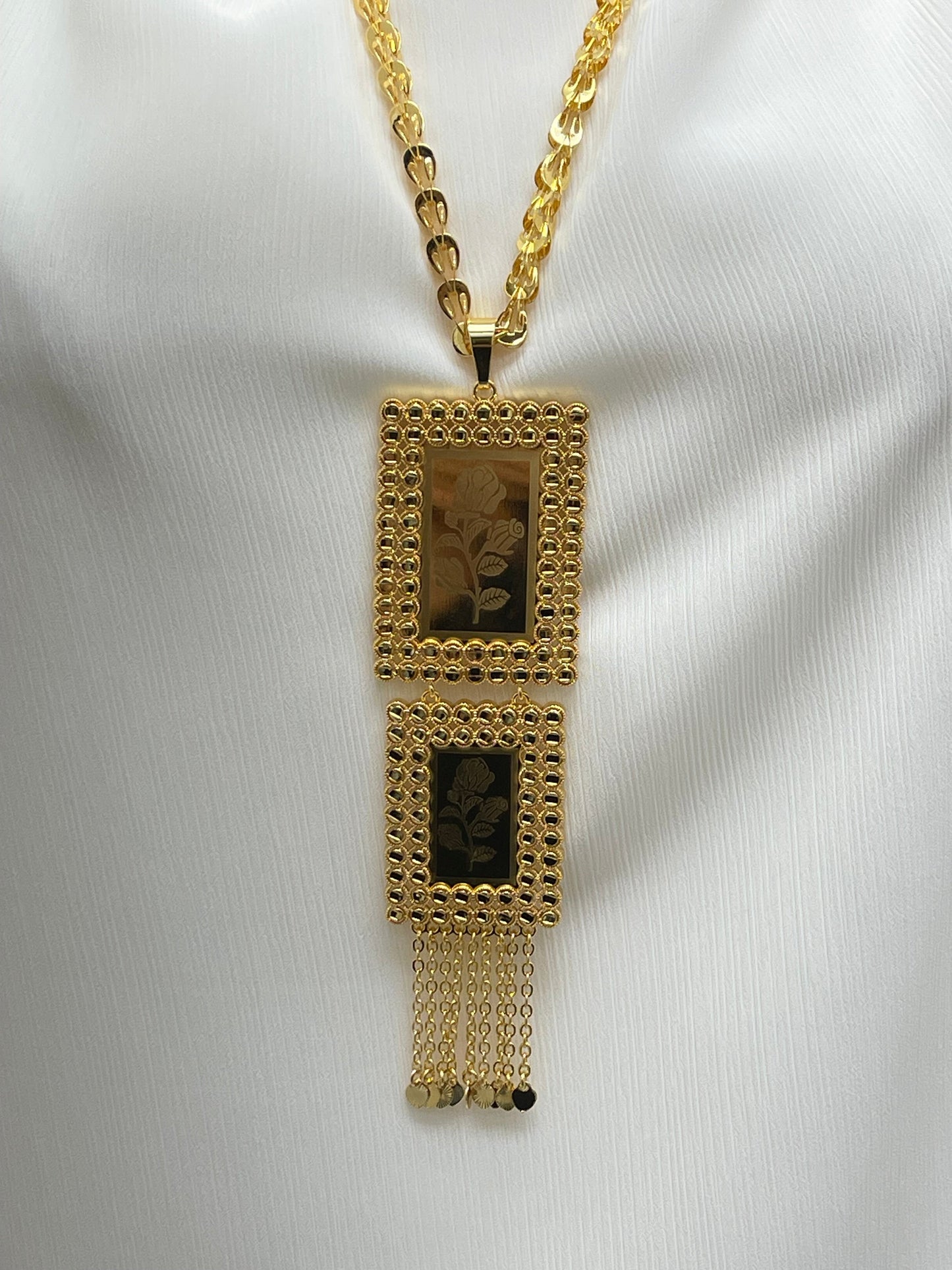 Palestinian embroidered gold necklace with two rectangular pendants and chain tassels