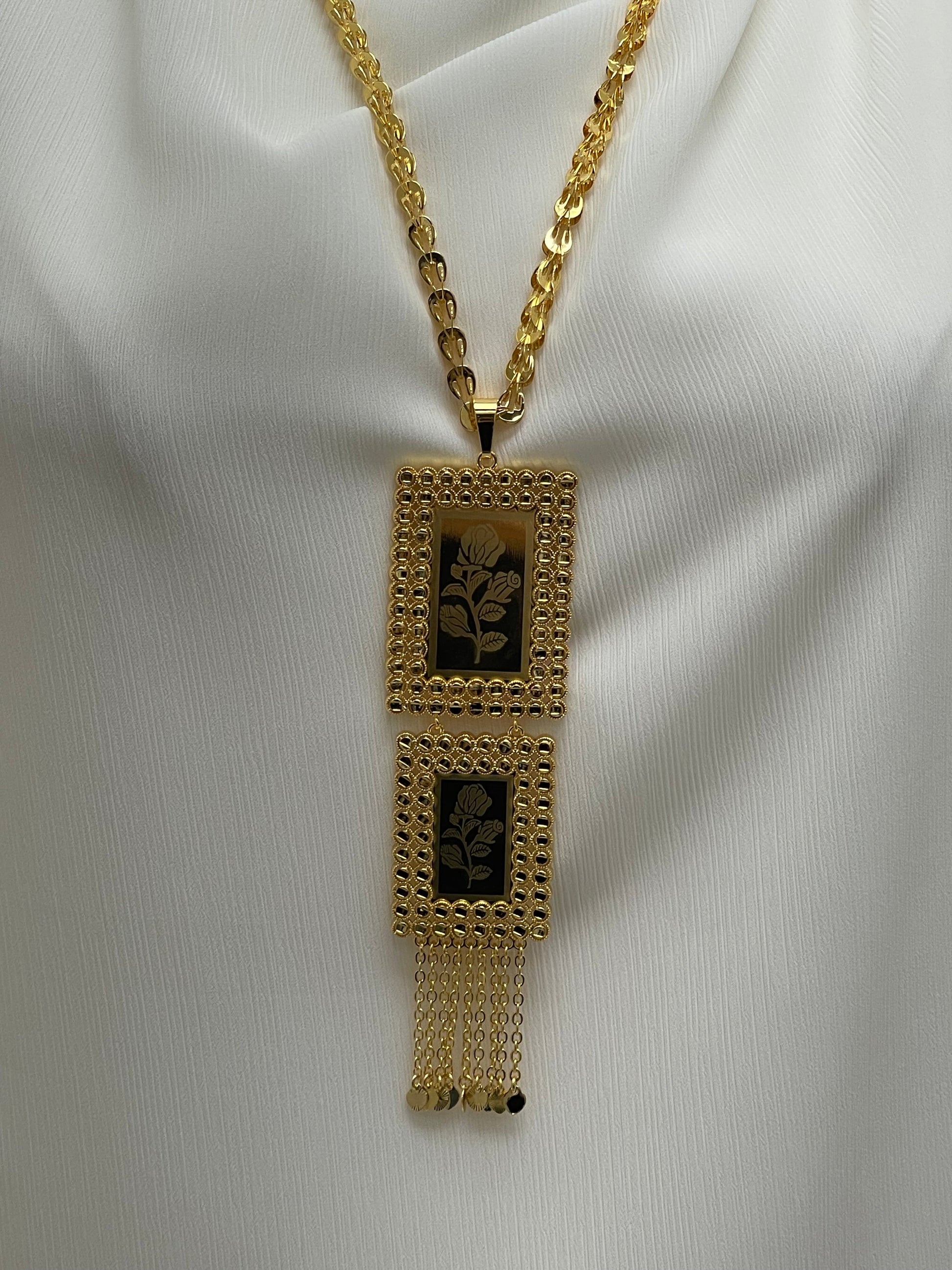 Palestinian embroidered gold necklace with rectangular floral pendants and gold chain from Palestinian Elegance