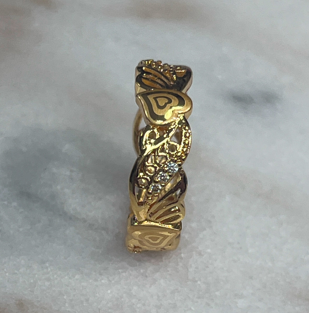 Palestinian embroidered ring in gold tone with intricate heart and leaf designs from Palestinian Elegance accessories