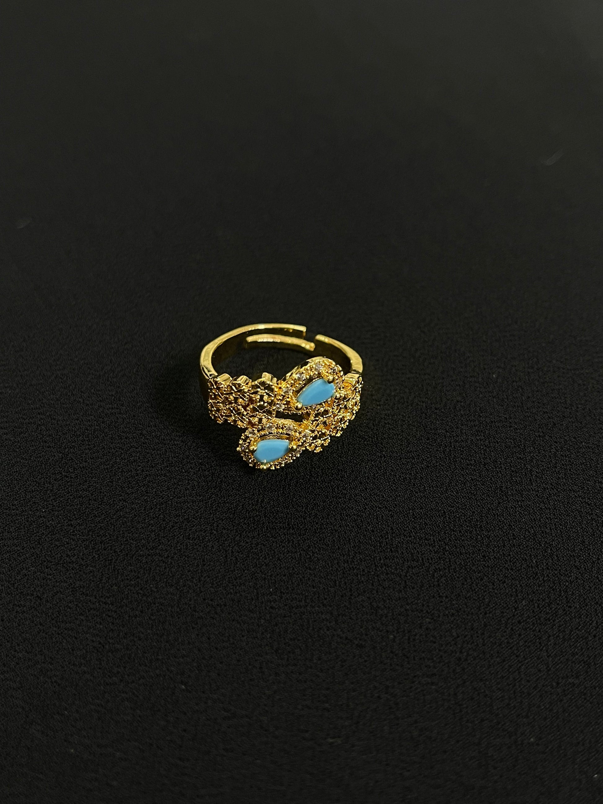 Delicate gold ring with turquoise stones from Palestinian gold jewelry set by Palestinian Elegance