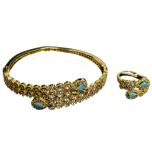 Palestinian gold jewelry set featuring a gold bracelet and ring with turquoise stones and intricate design