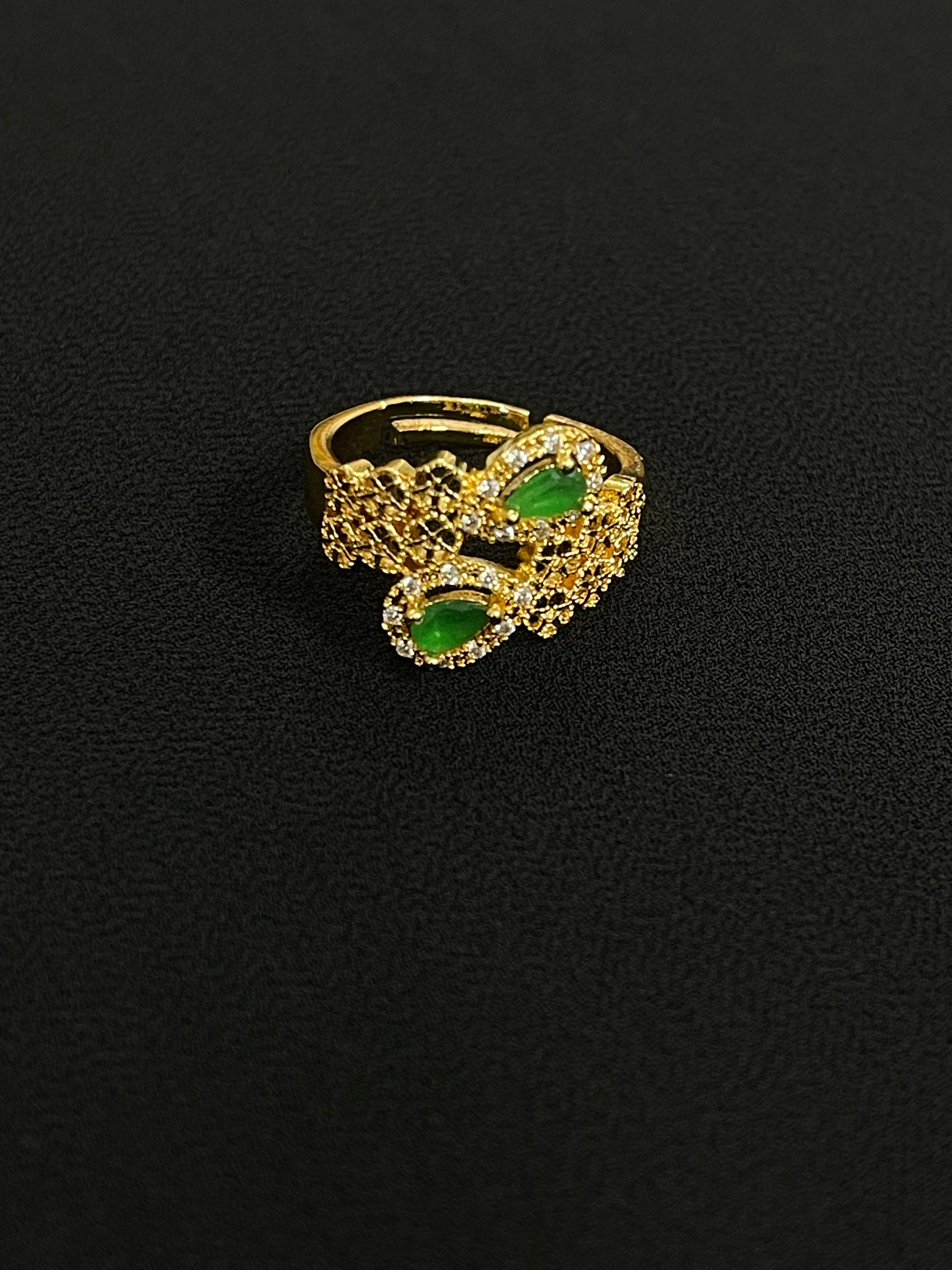 Elegant Palestinian gold jewelry set ring with green stones and intricate gold detailing