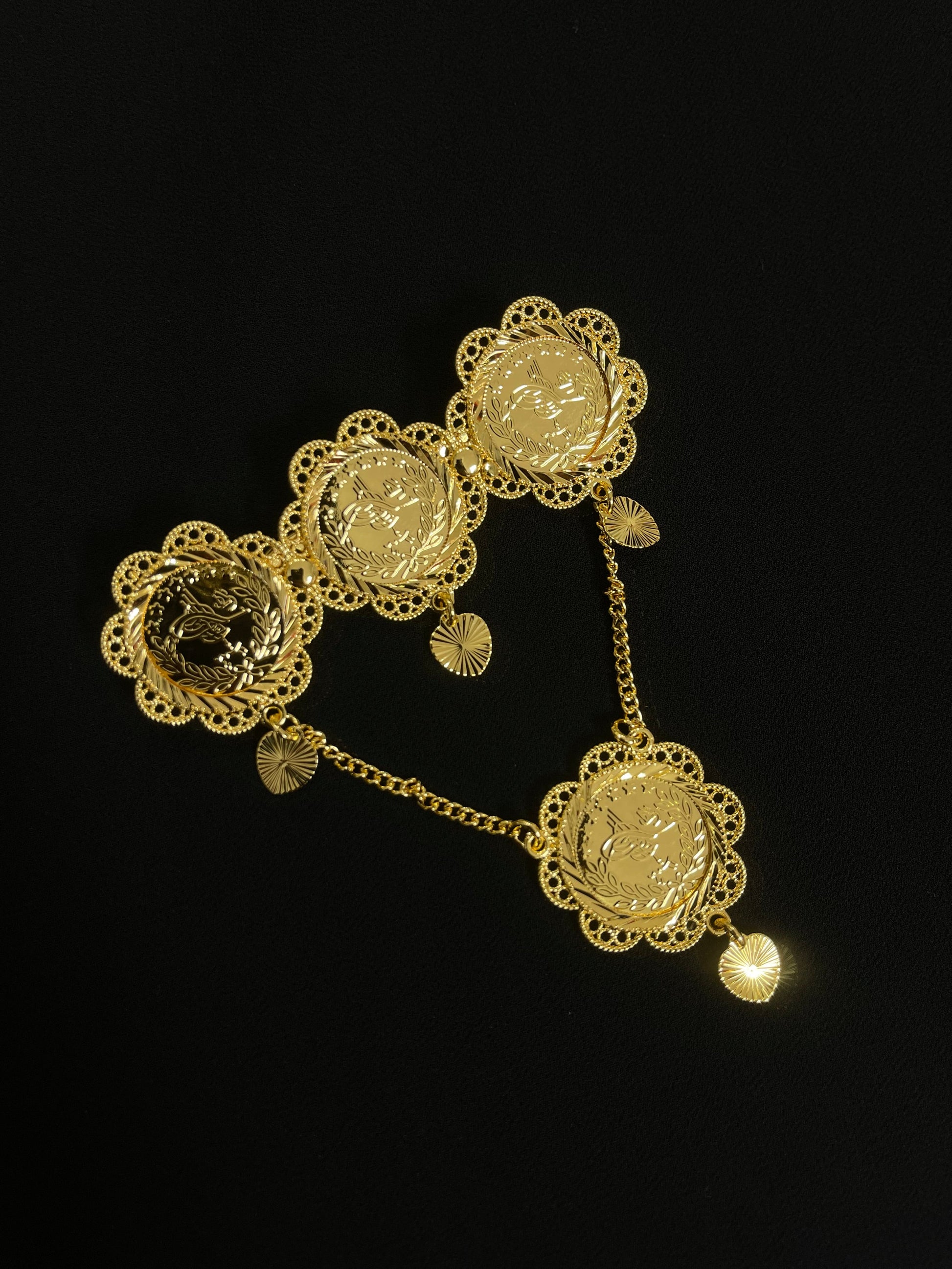 Palestinian gold pin jewelry with intricate floral design and connecting gold chains from Palestinian Elegance