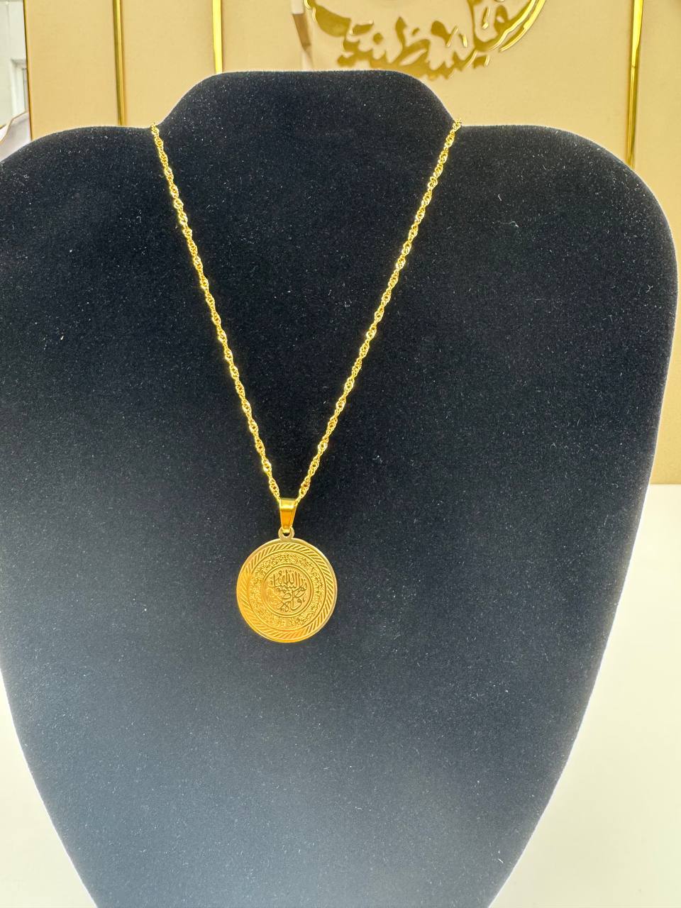 Palestinian Elegance imitated gold necklace with Quran Ayah gold bracelet pendant on display stand