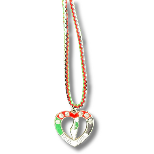Palestinian Elegance Al Quds Heart necklace with red green and white colors on a patterned ribbon